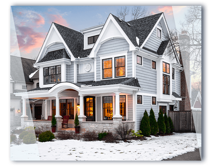 Large home with a snow-covered yard in a neighborhood.
