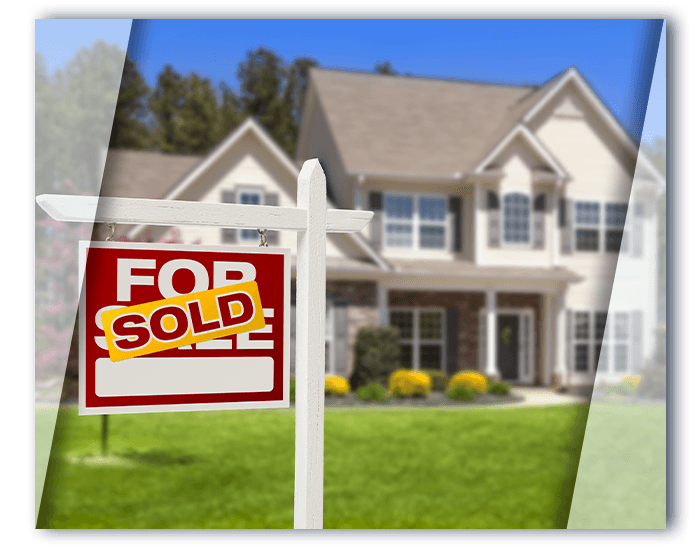 Home with “For Sale” sign out front with a “Sold” sticker over it.