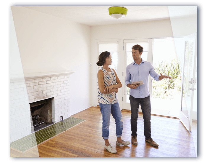 Realtor showing a woman around a home.