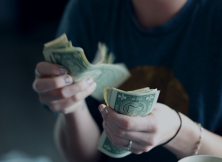 person counting rent money