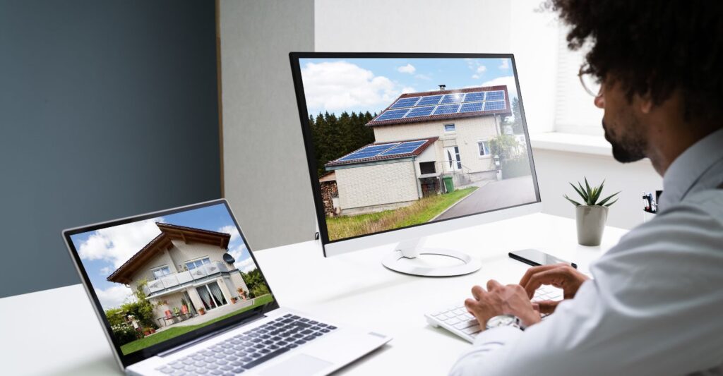 a man looking at homes on a website