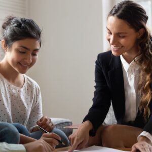 a business woman looking at paperwork with a client