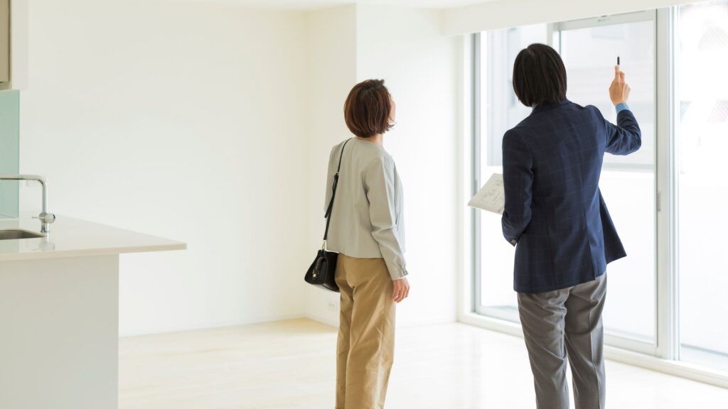 woman and real estate agent viewing property
