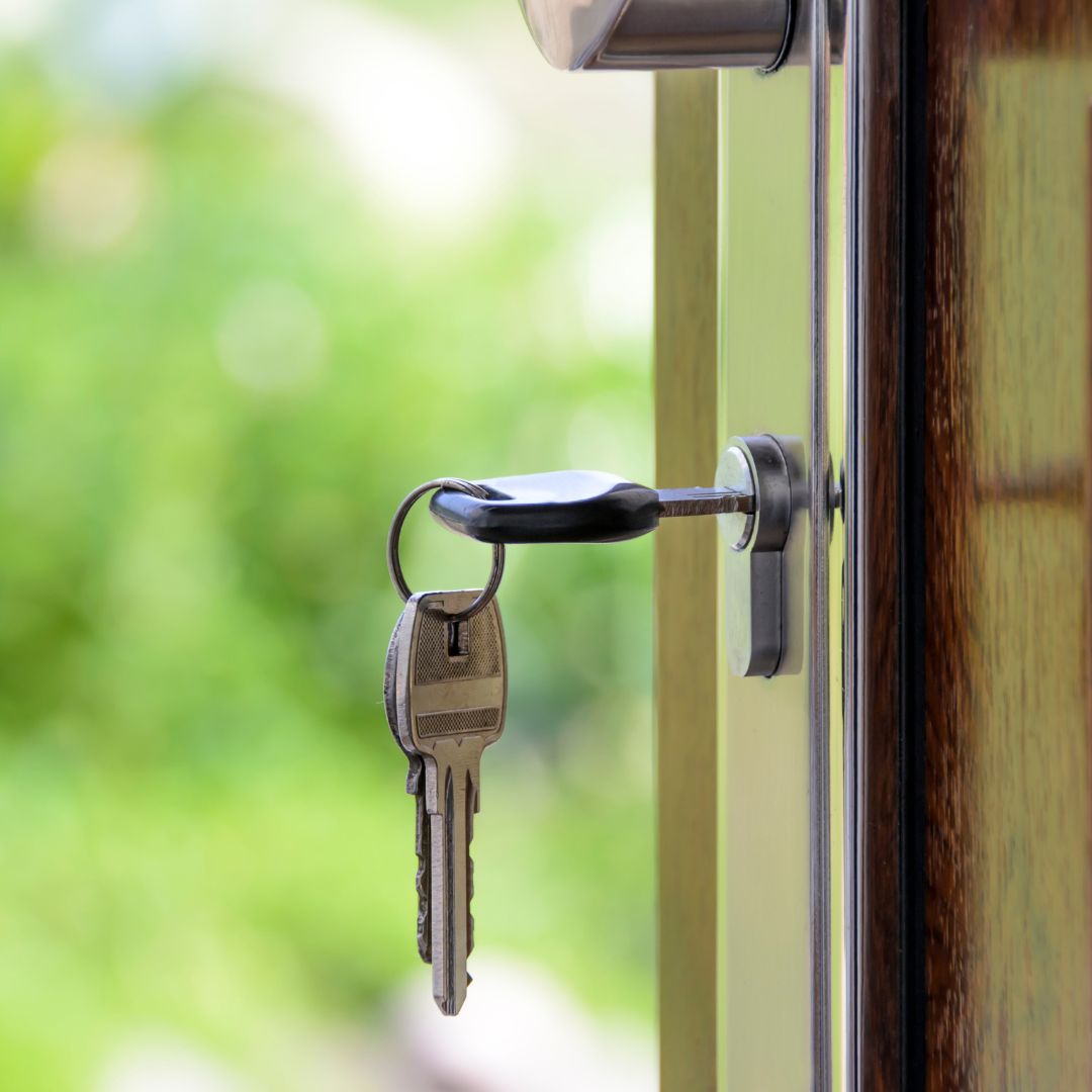 Set of keys hanging from an open door
